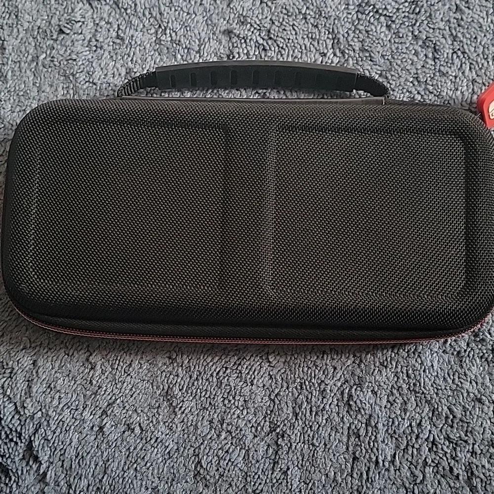Nintendo Switch Game Traveler Deluxe Case, black, gently used.